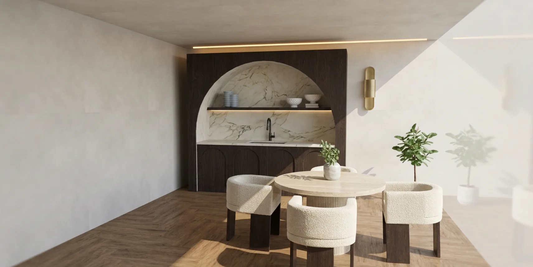 Cocina con hornacina en arco de madera oscura, encimera de mármol y mesa redonda con sillas de bouclé
